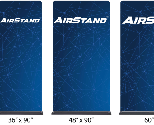 airstand-tension-fabric-banner-stands-1 AirStand tension fabric banner stands placed side by side, showing all four widths which are 24", 36", 48", and 60". Each AirStand™ is upright with full blue geometric graphics and black bases visible.